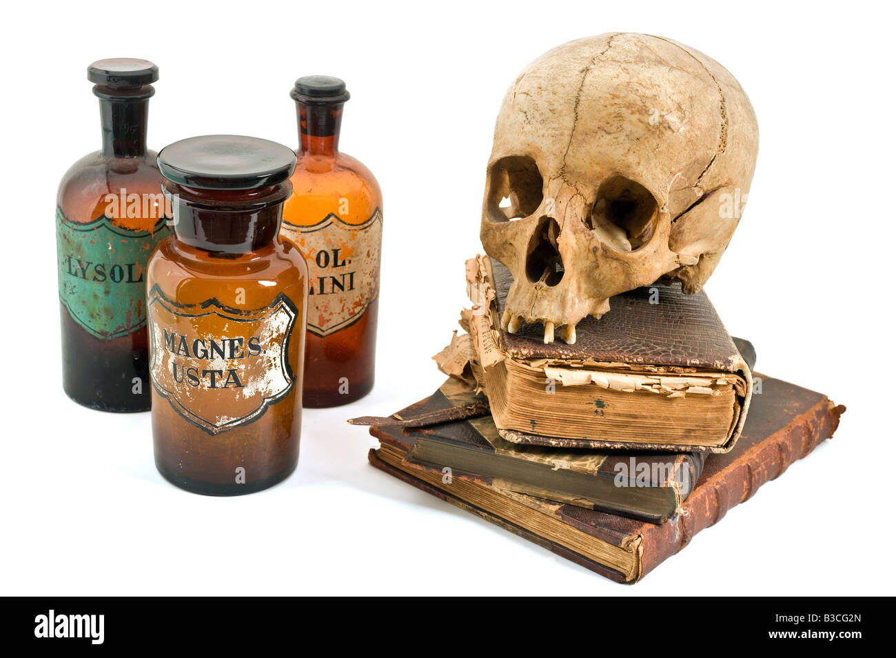 skull old books old drug bottles isolated on white Stock Photo