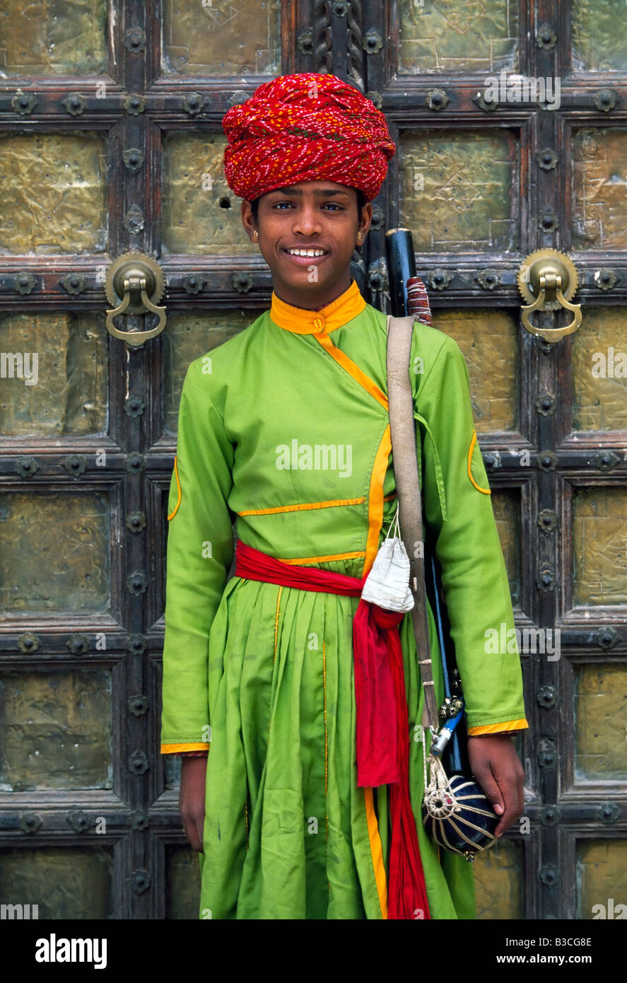 Young musician in traditional dress, Samode Palace, Jaipur, Rajasthan