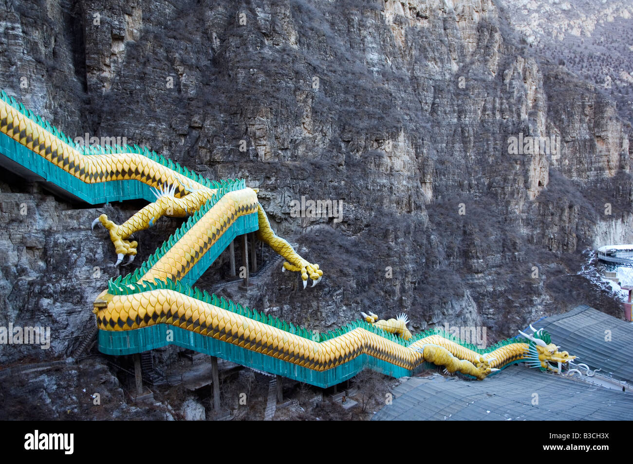 China, Beijing, Longqing Gorge Tourist Park. A dragon climbing down the mountainside. Stock Photo