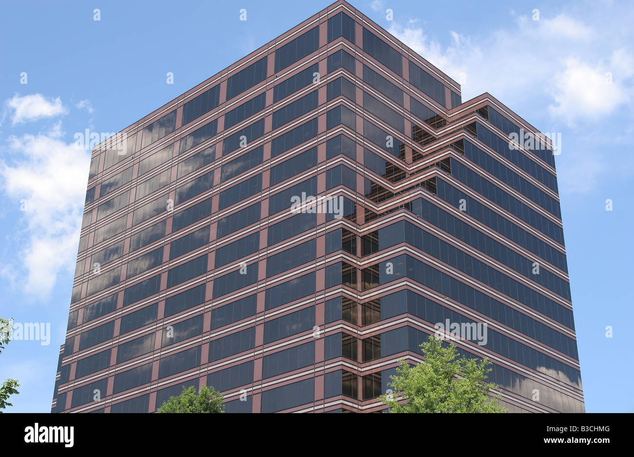 Brick and Glass Office Tower reflecting sky and clouds Stock Photo - Alamy