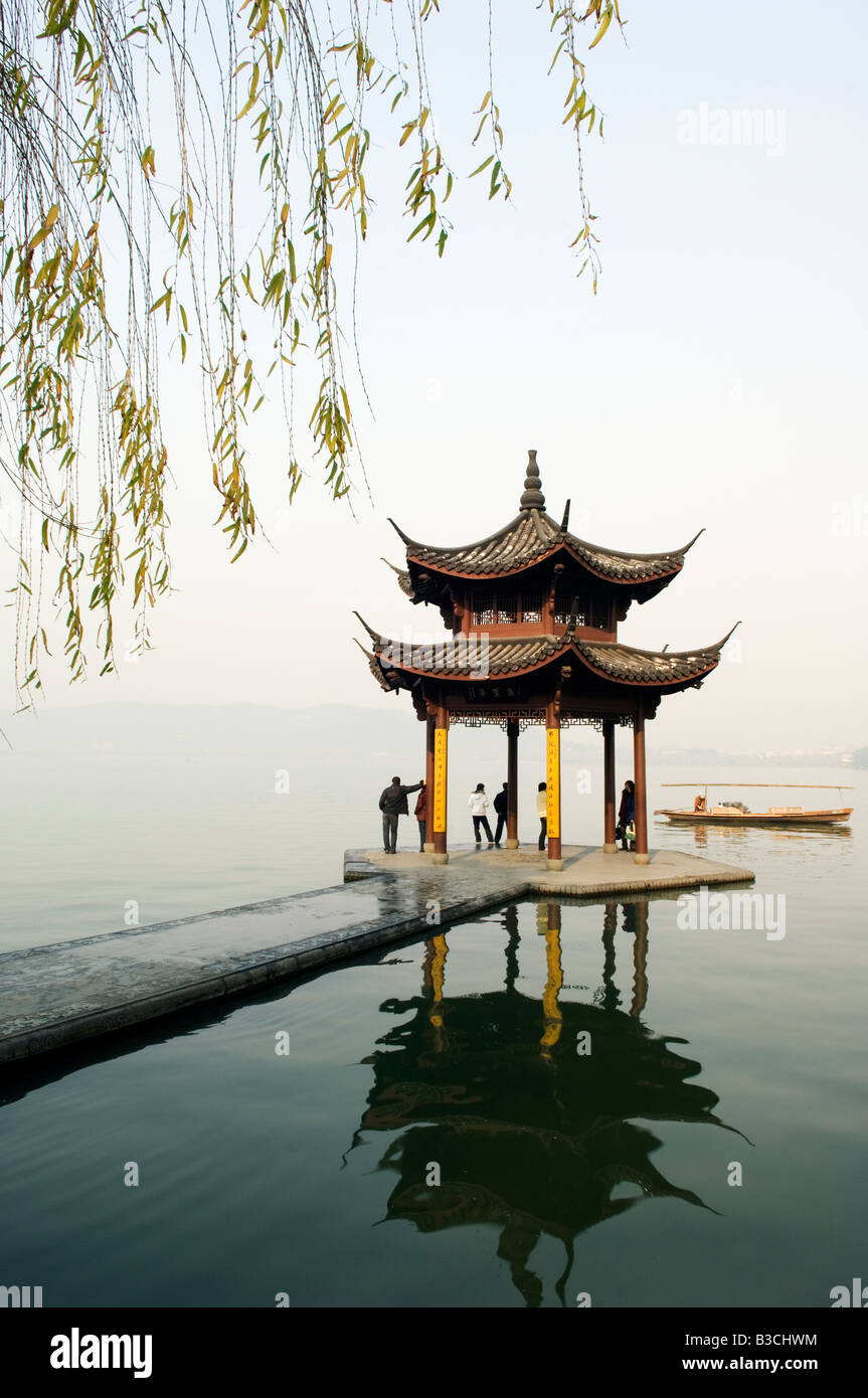 China, Zhejiang Province, Hangzhou. A pavillion early in the morning on West Lake. Stock Photo
