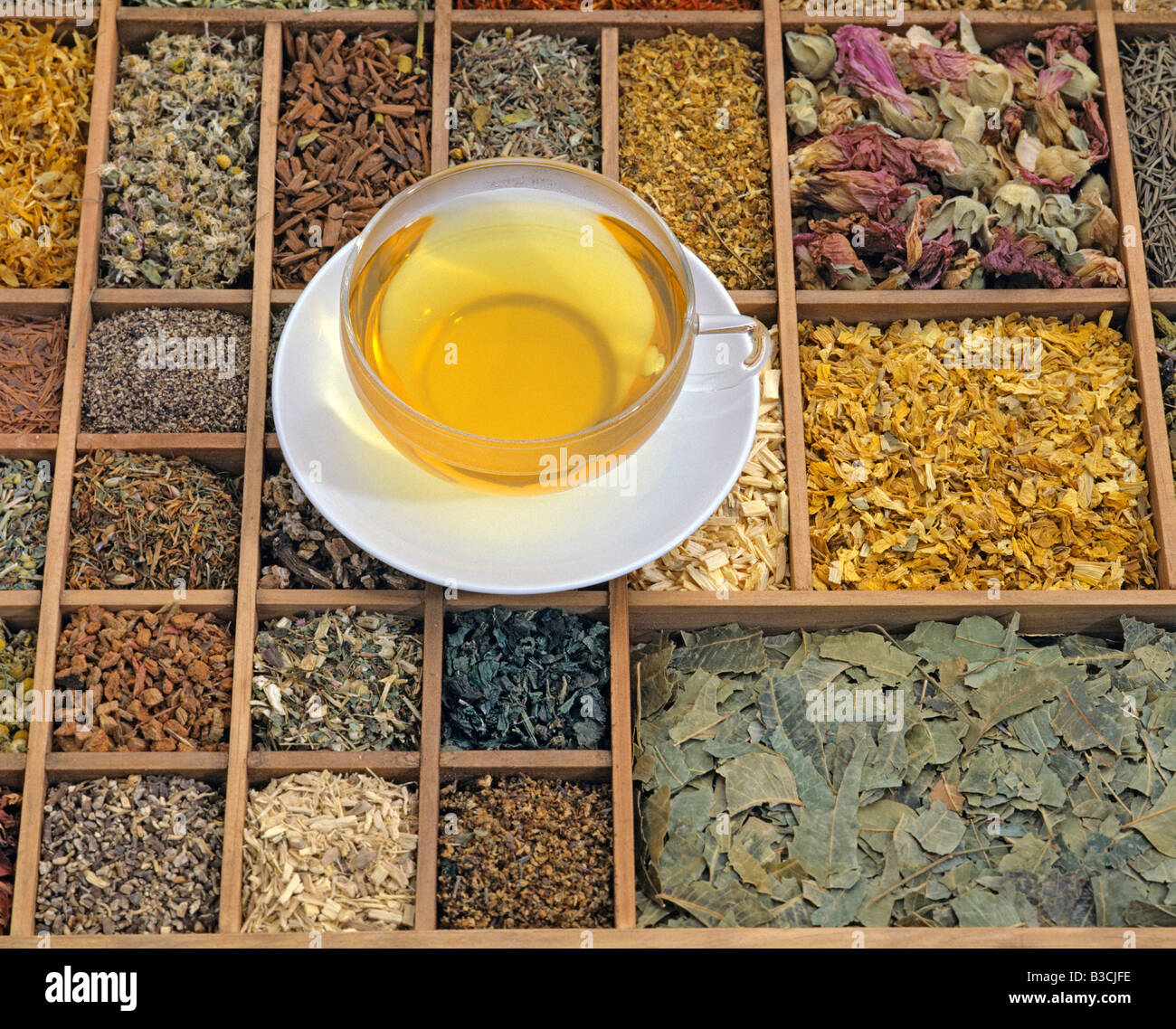 herb tea on a mix of various dried herbs Stock Photo