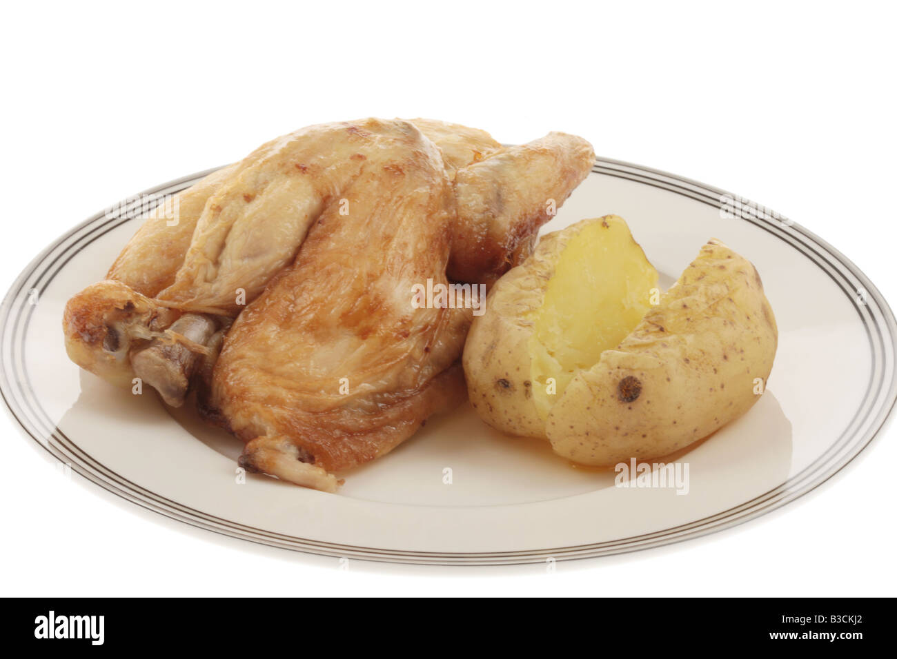 Half A Spit Roast Chicken with Jacket Potato Stock Photo Alamy