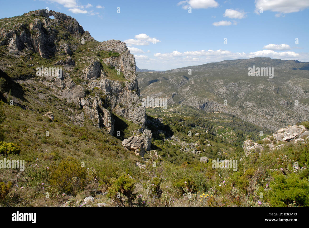 view to Penal Gros, Forada Rock Arch & Vall de Gallinera, Sierra de la Forada, Alicante Province, Comunidad Valenciana, Spain Stock Photo