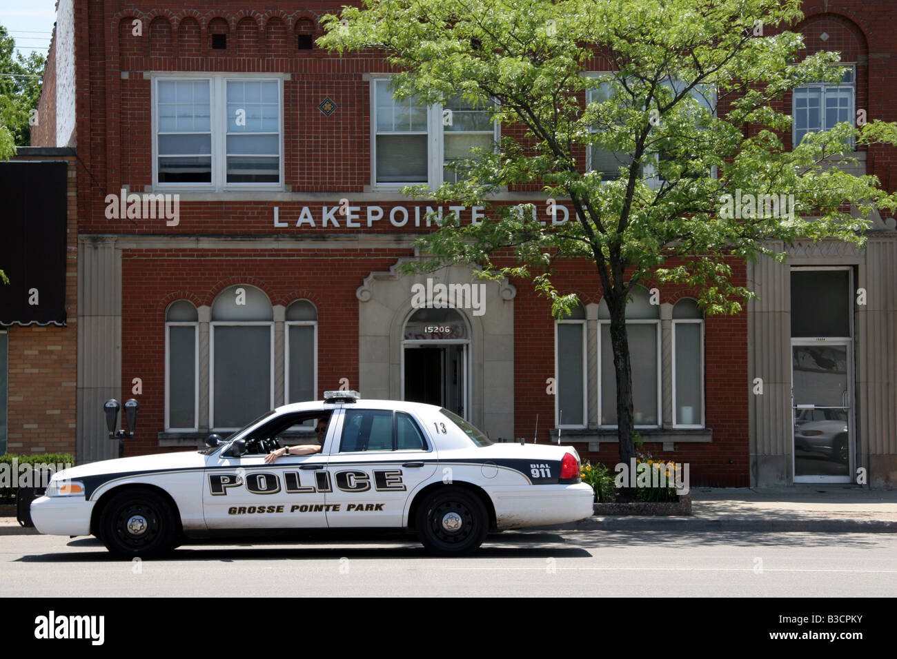 Grosse Pointe Park police car parked along Mack Avenue Detroit Michigan
