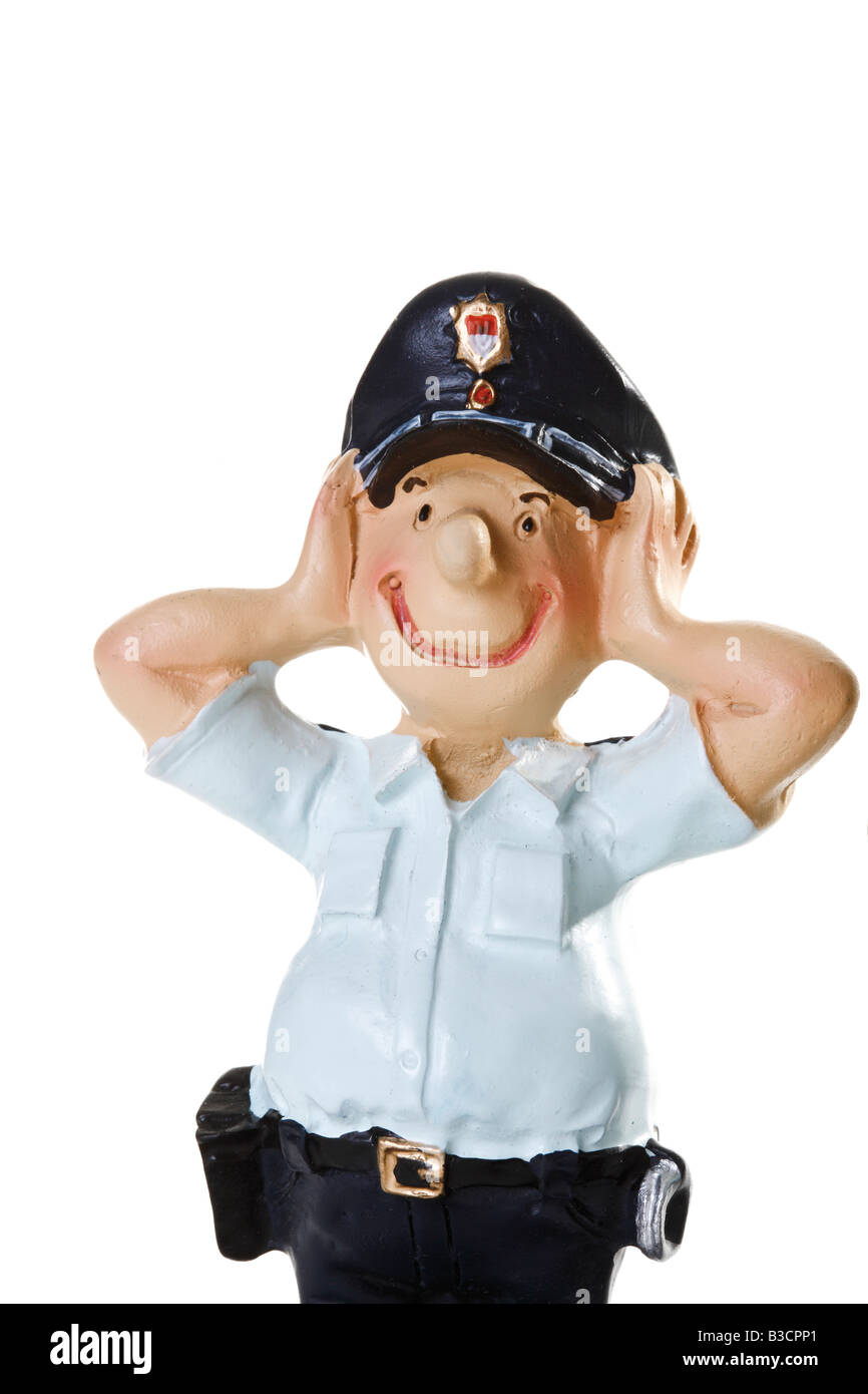 Plastic Figurine of a Policeman, Hear no evil, close-up Stock Photo