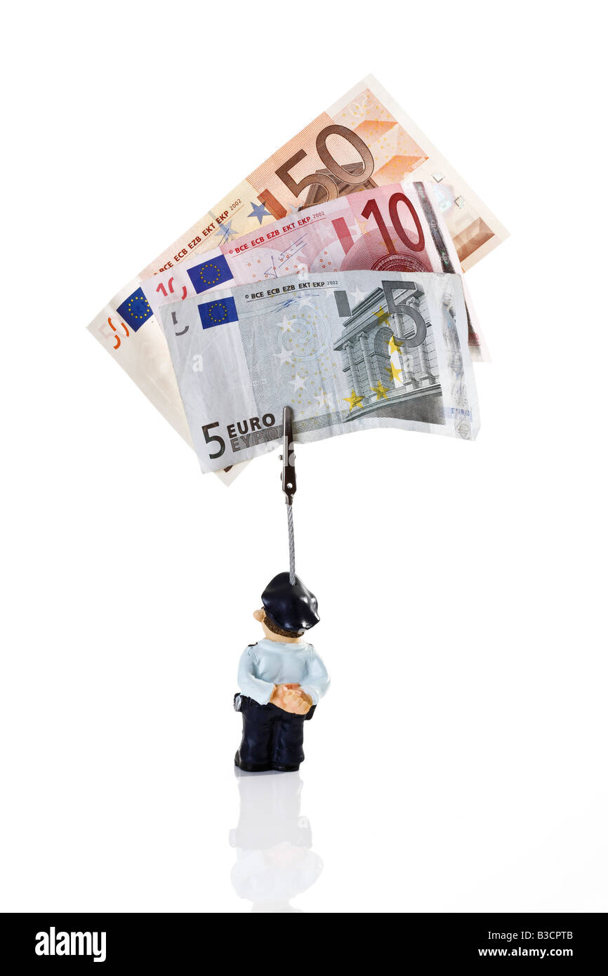 Policeman figurine holding Euro notes, rear view Stock Photo