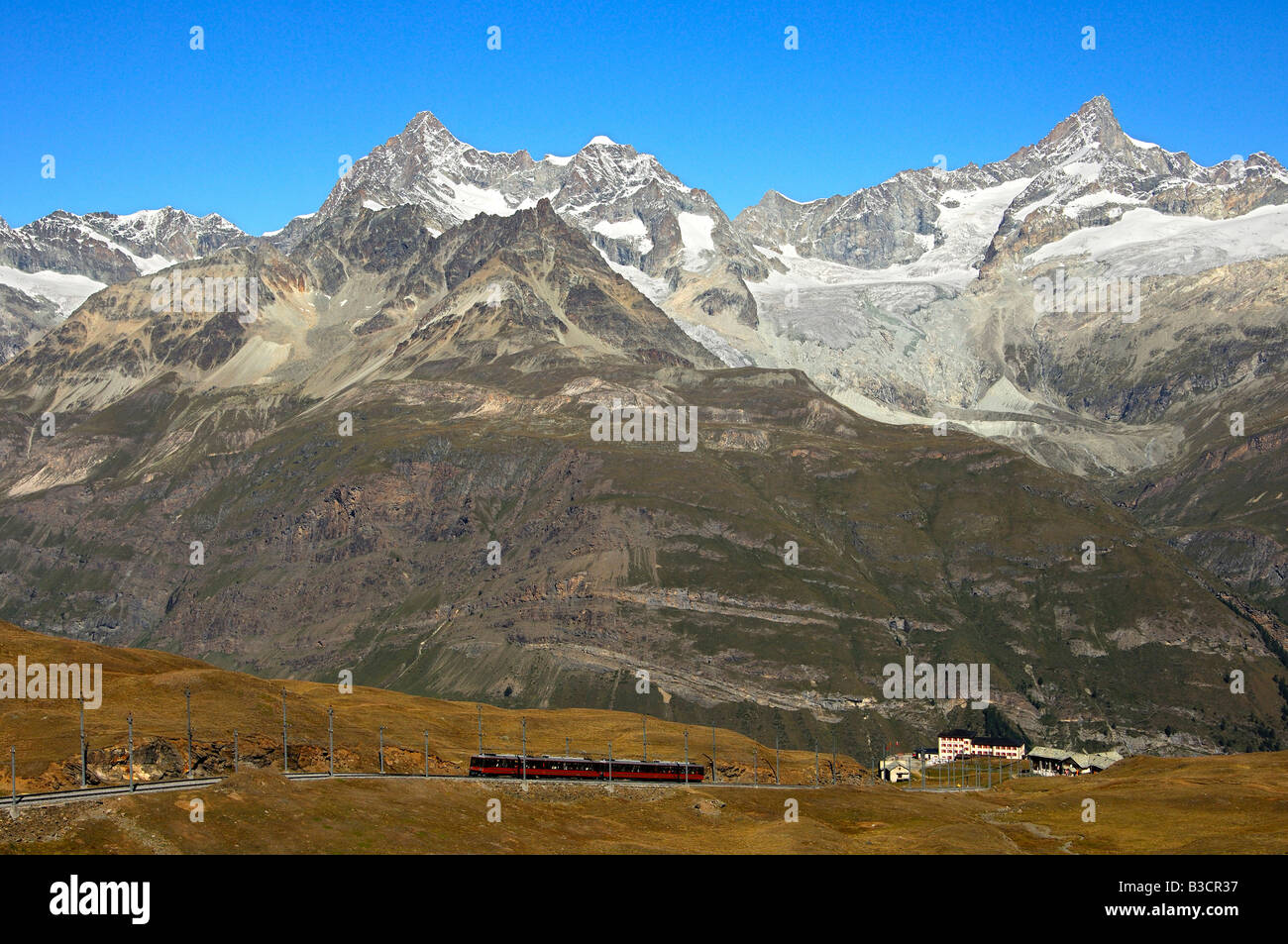 Rack railway Gornergratbahn. in the back Mt Oberes Gabelhorn. Wellenkuppe. Zinalrothorn, Zermatt. Valais, Switzerland Stock Photo