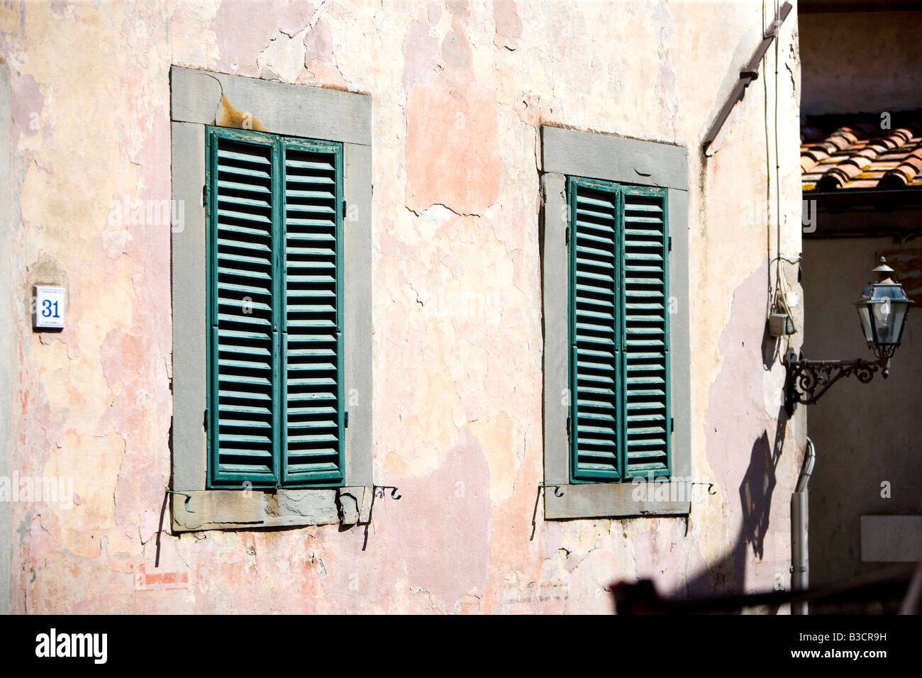 Old green shutter Coreglia Antelminelli Garfagnana Tuscany Italy Stock Photo