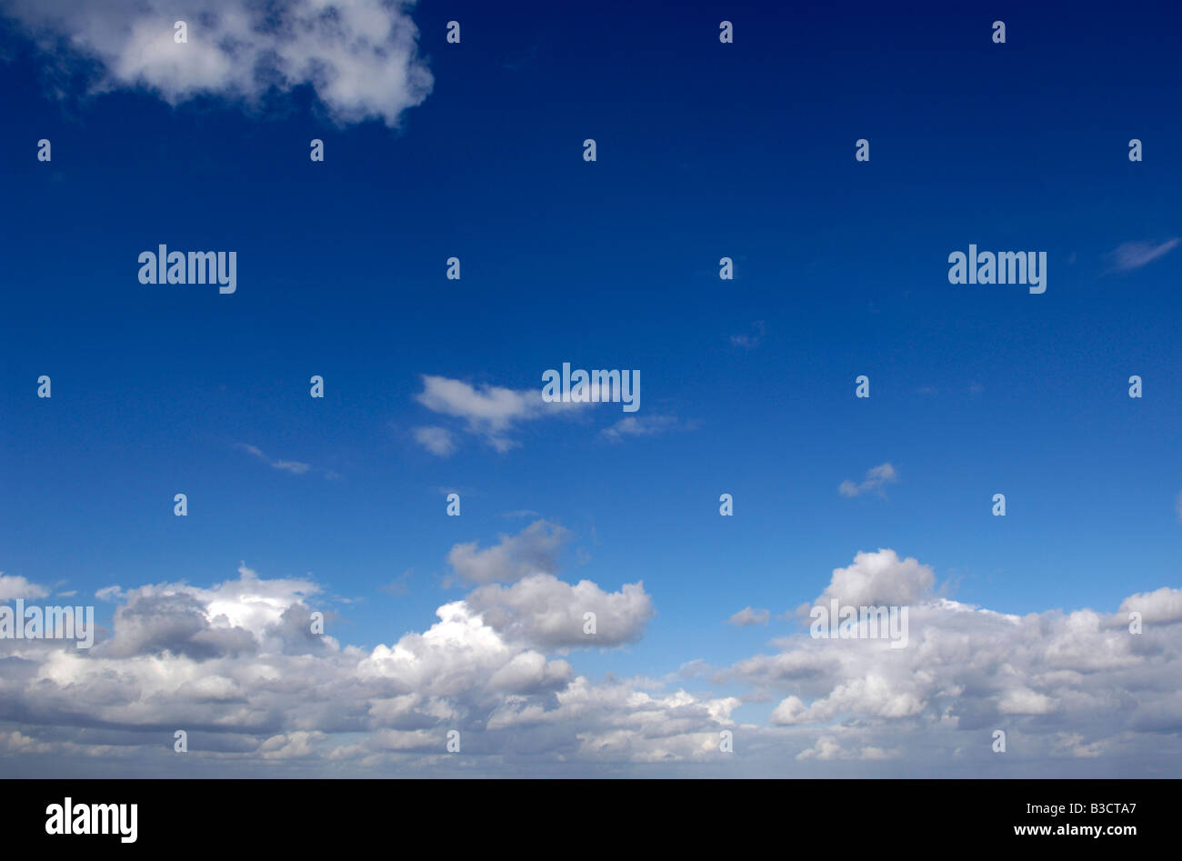 blue sky with white and grey fluffy clouds cloud Stock Photo - Alamy