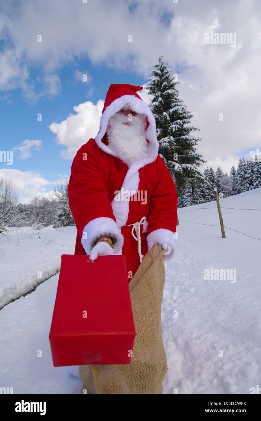 Santa Claus Father Christmas in a beautiful winter landscape Stock Photo Alamy
