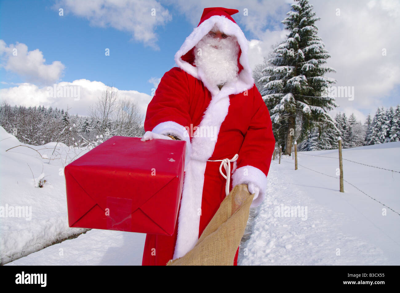 Santa Claus Father Christmas in a beautiful winter landscape Stock Photo Alamy