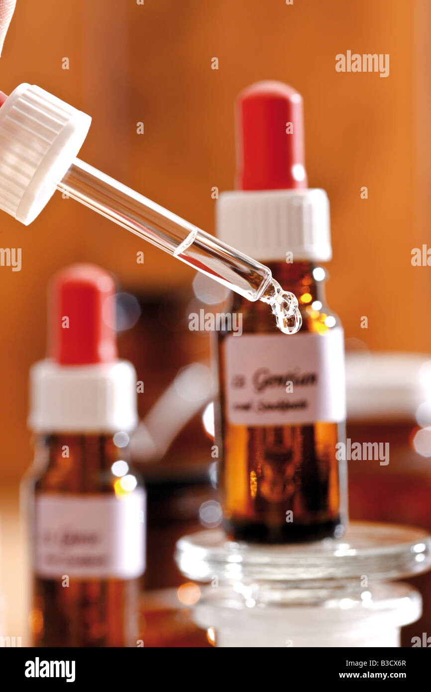 Homeopathic remedies, Drop falling from a pipette, close-up Stock Photo