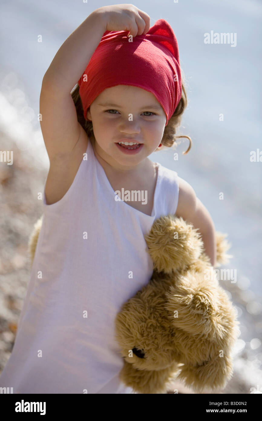 Germany, Bavaria, Ammersee, little girl (3-4) with teddy bear Stock Photo