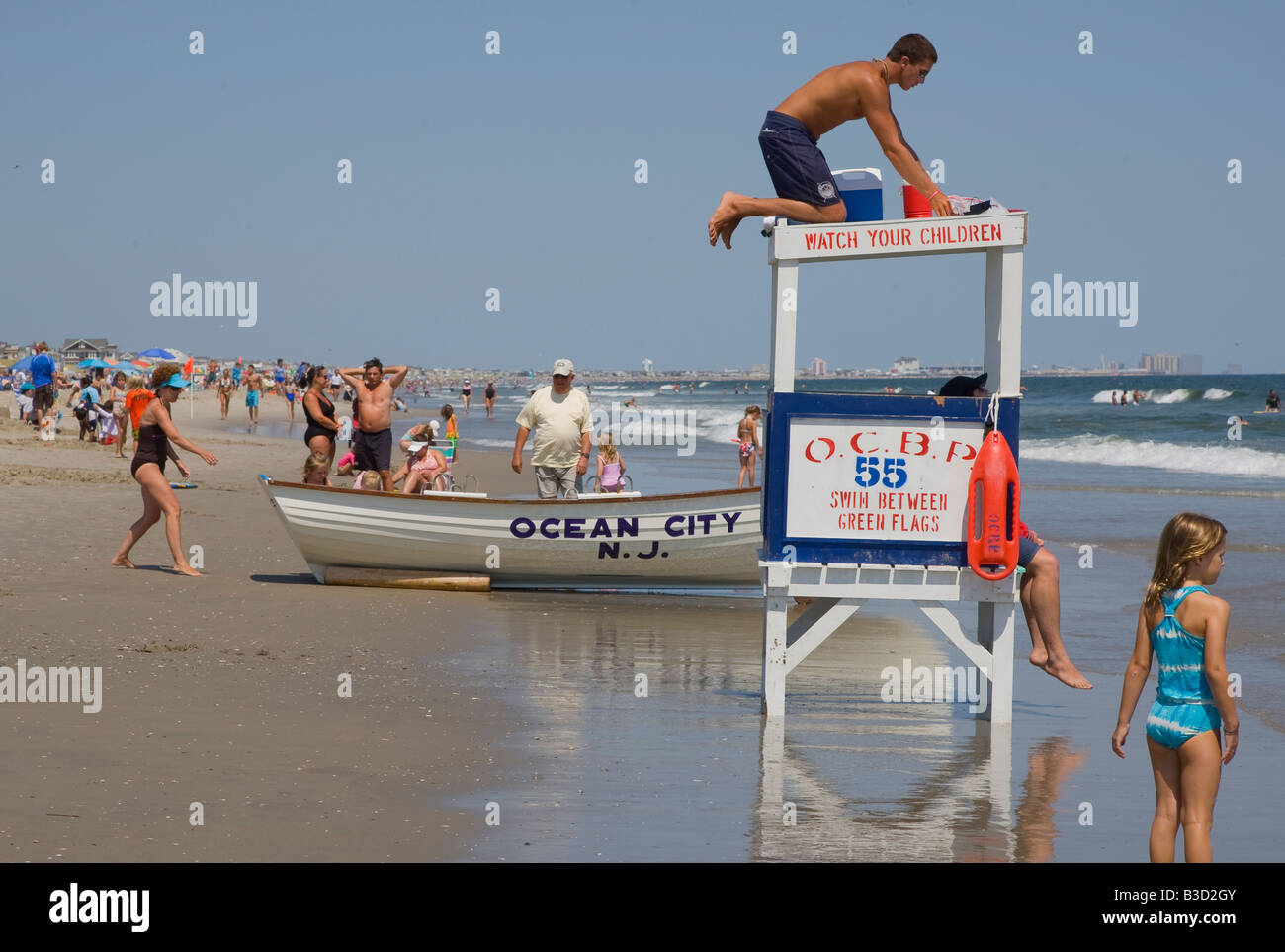 Lifeguard getting on a lifeguard stand Stock Photo Alamy