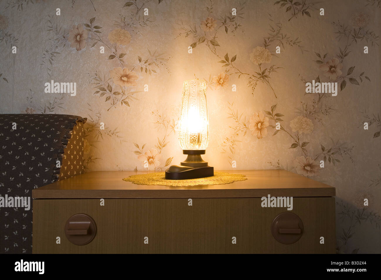 Illuminated lamp on commode Stock Photo - Alamy