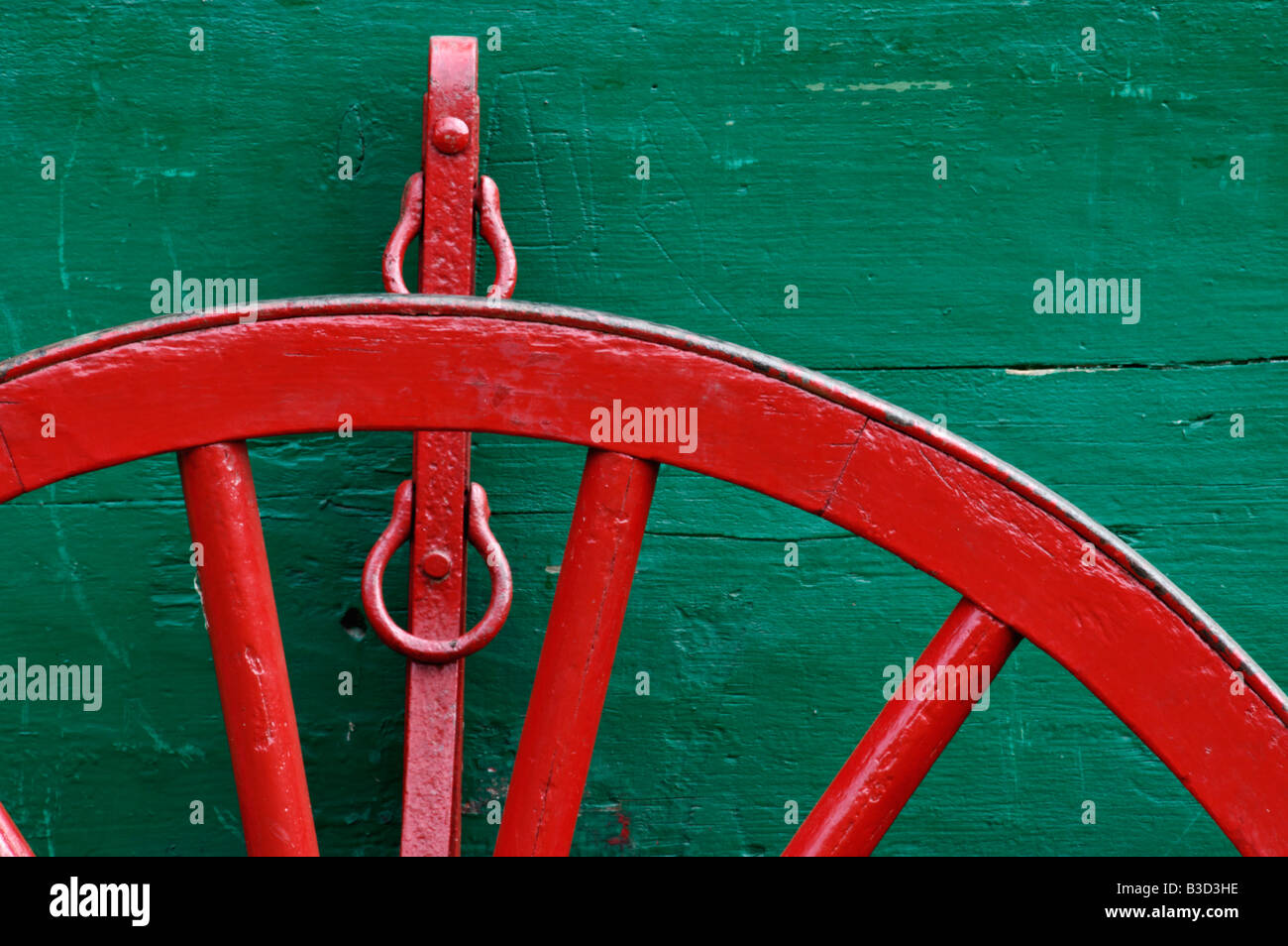 Detail of Red Wagon Wheel and Green Wagon at Oconaluftee Visitor Center in the Great Smoky Mountains National Park Stock Photo