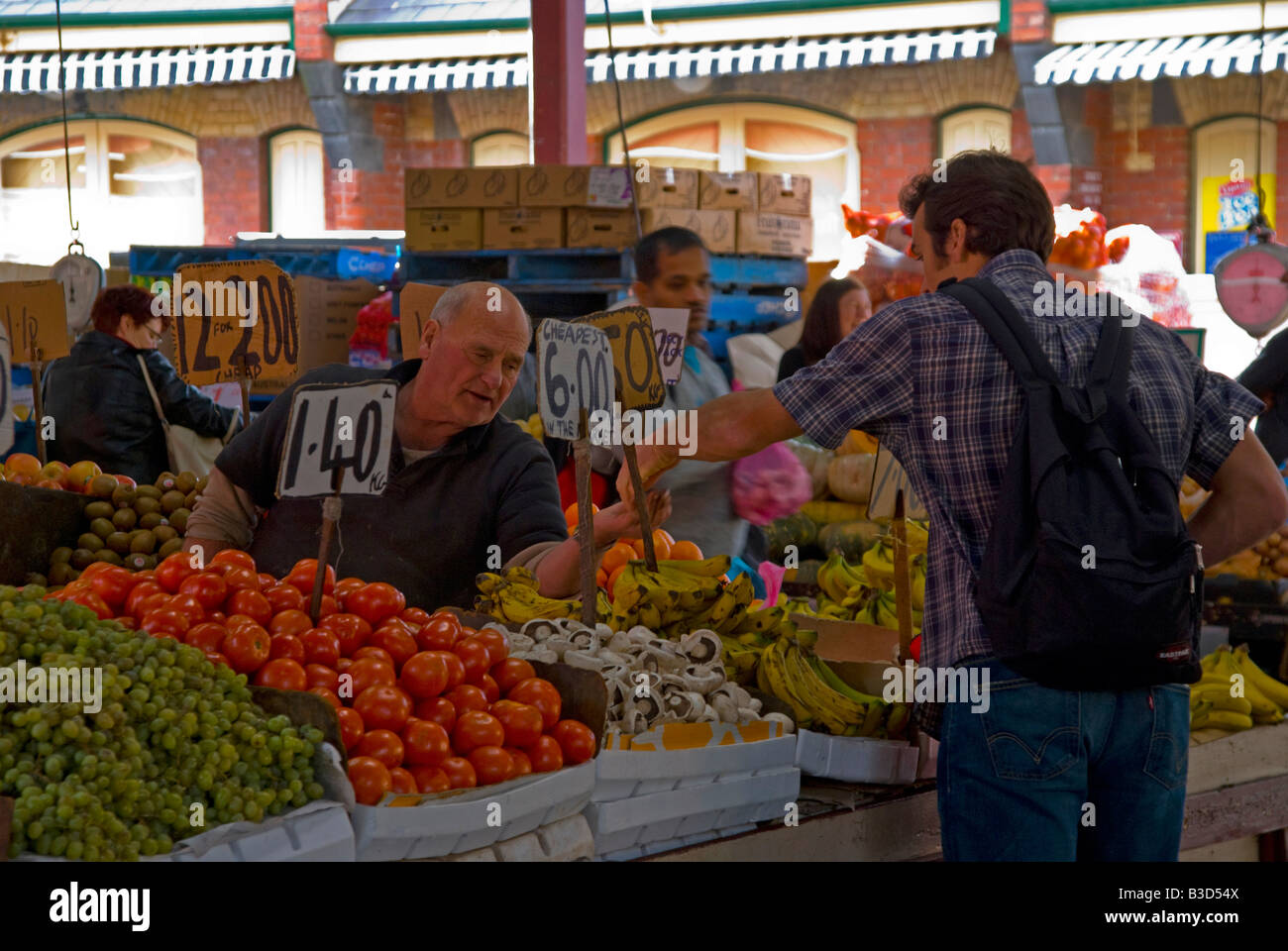 Shopping for fruit and fresh vegetables in Queen Victoria Market Melbourne Stock Photo