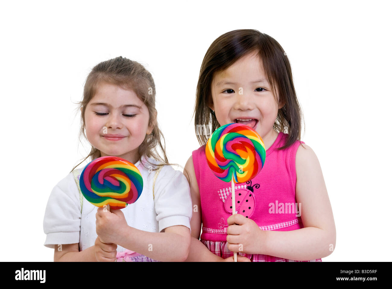 Two girls licking lollipops hires stock photography and images Alamy