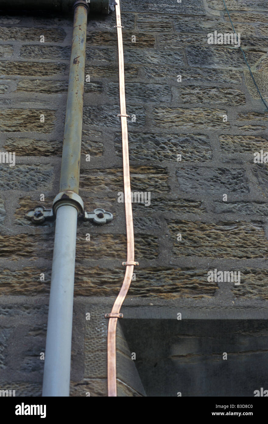 A shiny new copper lightning conductor Stock Photo