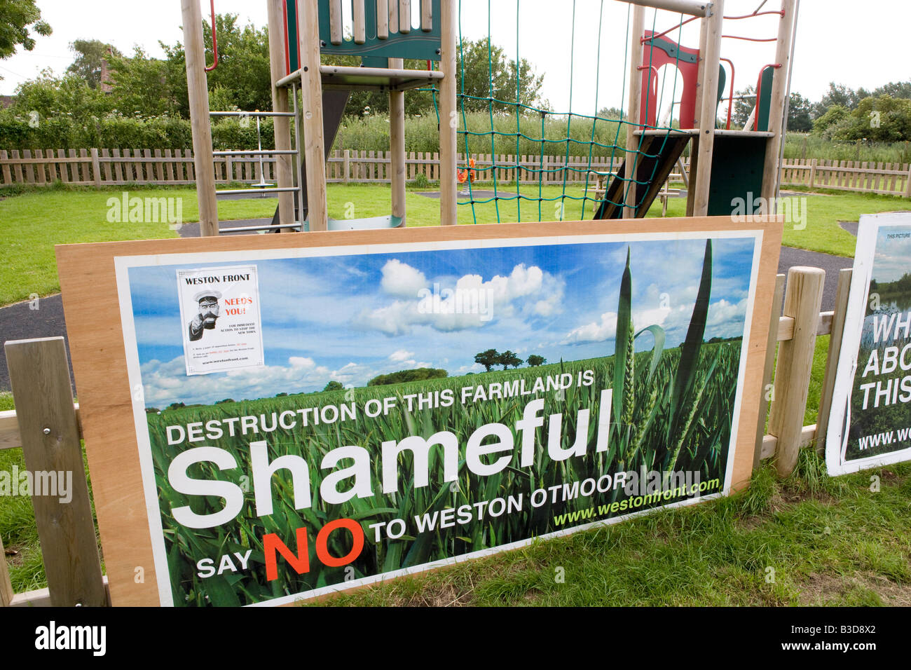 Residents display protest signs against the Weston On Otmoor eco town countering the Parkridge developments Eco town proposals Stock Photo
