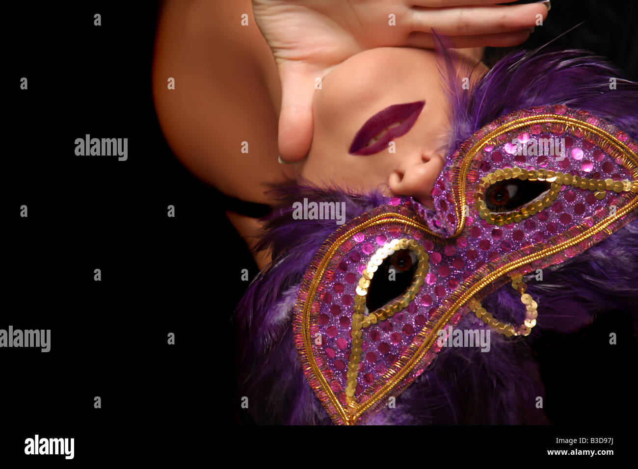 Woman in feathered mask hi-res stock photography and images - Alamy