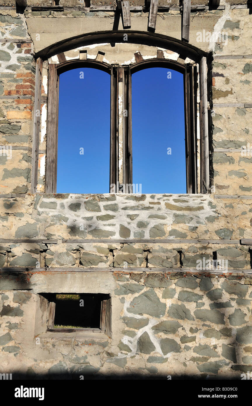 Architectural window detail of ruins of a house located in an old mining town in Crowsnest Pass, Alberta, Canada Stock Photo