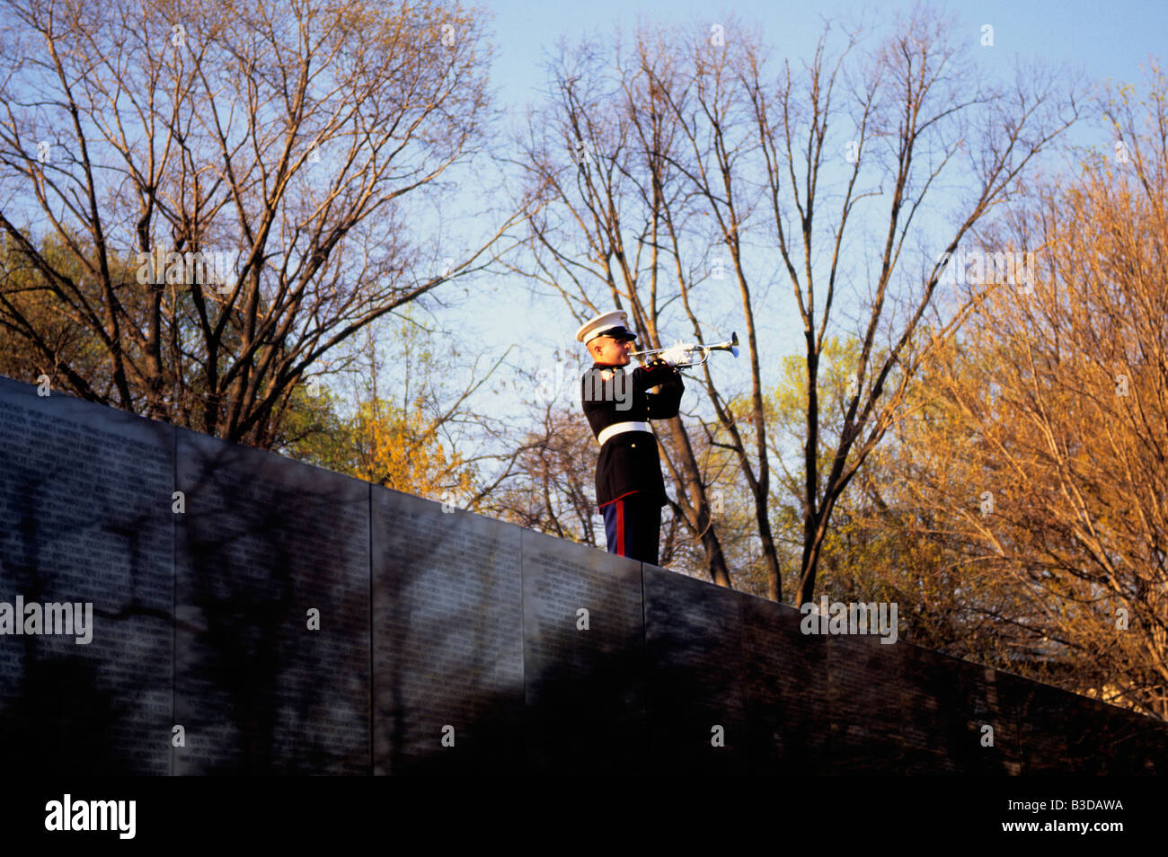 Washington DC Vietnam Veterans Memorial Wall and Marine playing taps Stock Photo