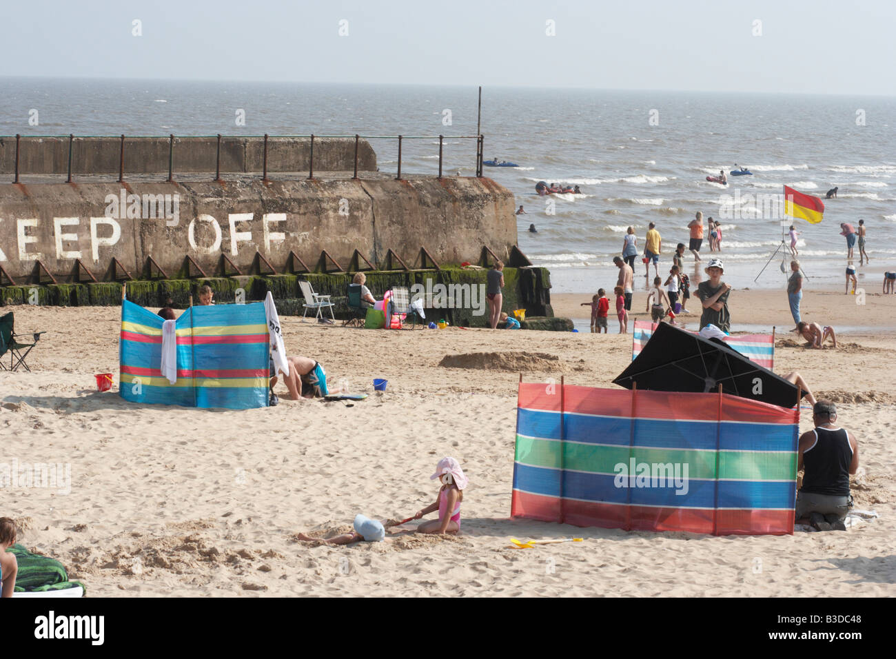 gorleston beach,summer time,wind breaks Stock Photo Alamy