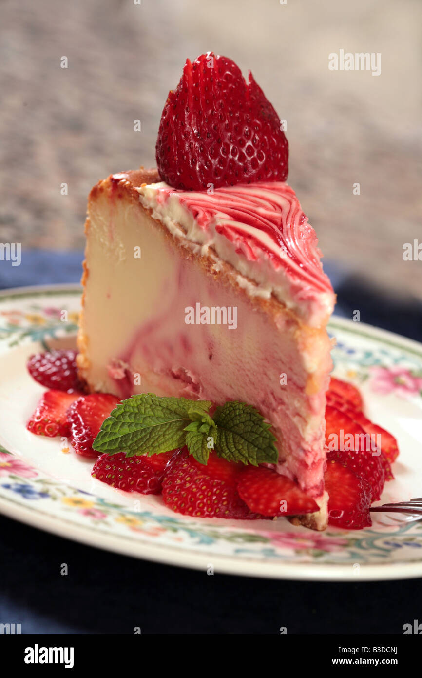 Strawberry Cheesecake With Sliced Strawberries and a Hint of Mint Stock Photo