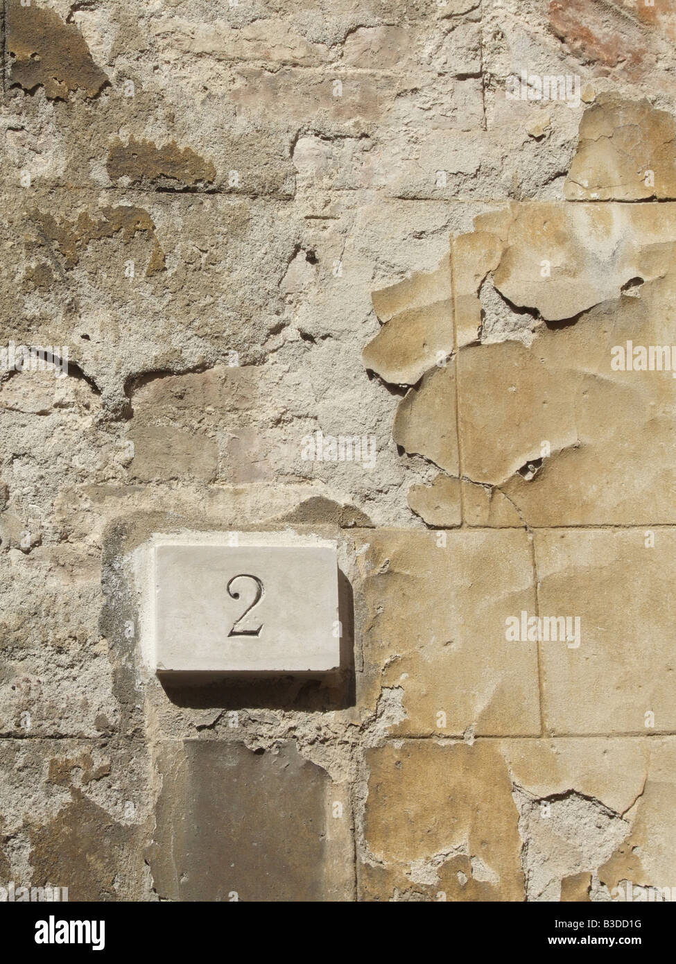 house number 2 paint flaking on old property wall in street in italy Stock Photo Alamy