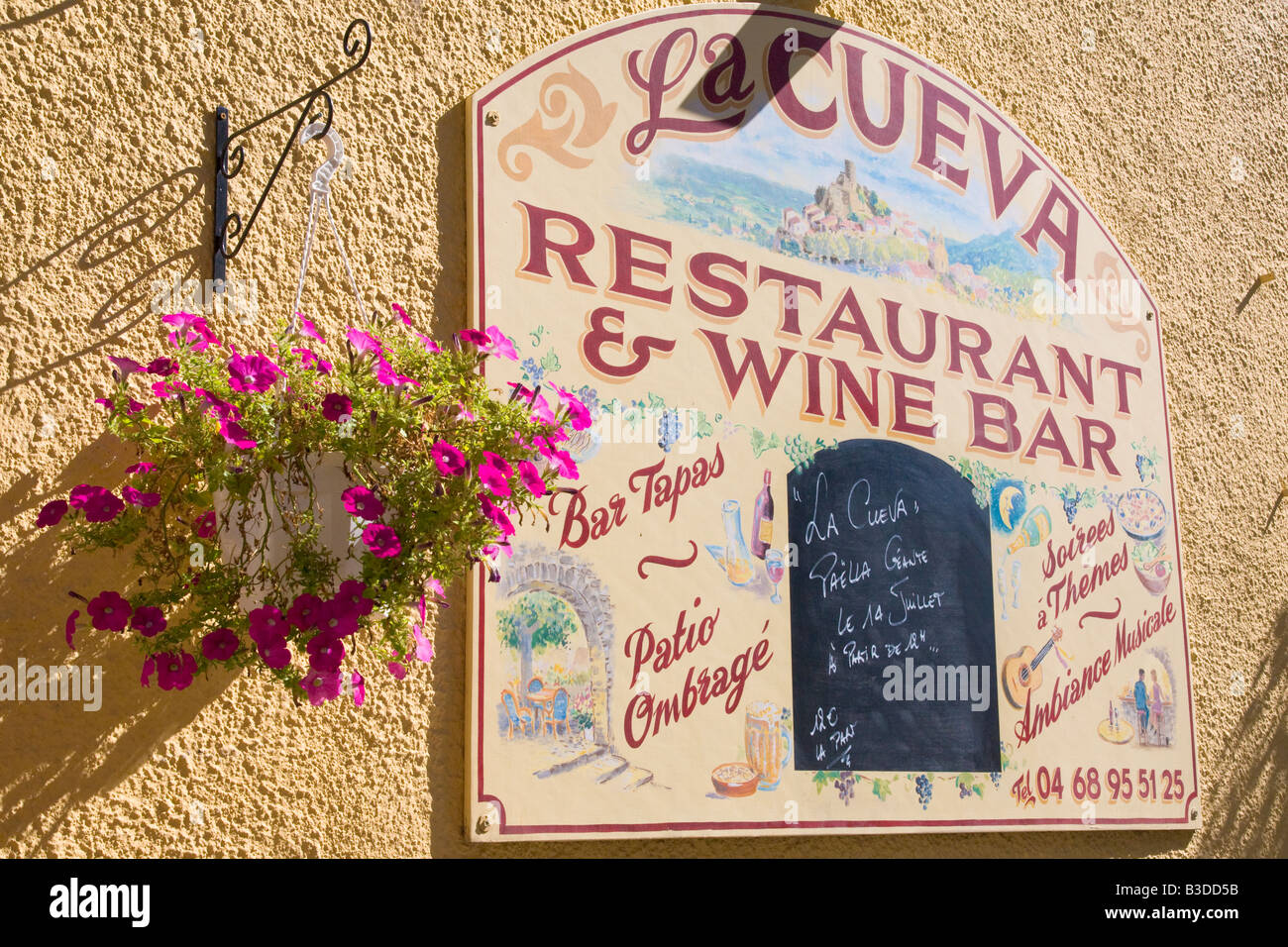 A signboard on the facade of a restaurant in southern France Stock Photo