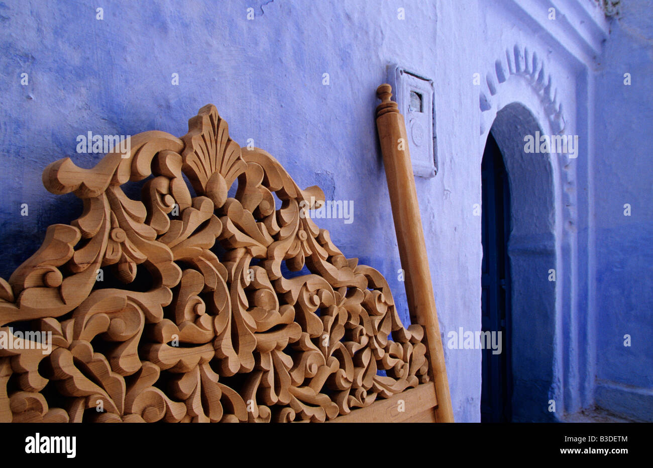 Carved bed head board and Carpenter's house in Chefchaouen aka Chauen aka Chaouen Morocco. Stock Photo