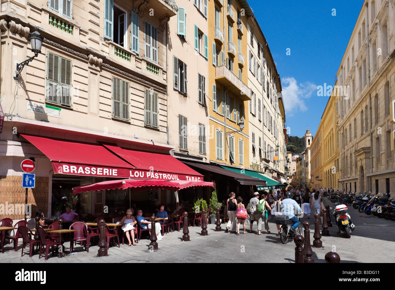 Brasserie and shops in the old town (Vieux Nice), Rue de la Prefecture, Nice, Cote d'Azur, French Riviera, France Stock Photo