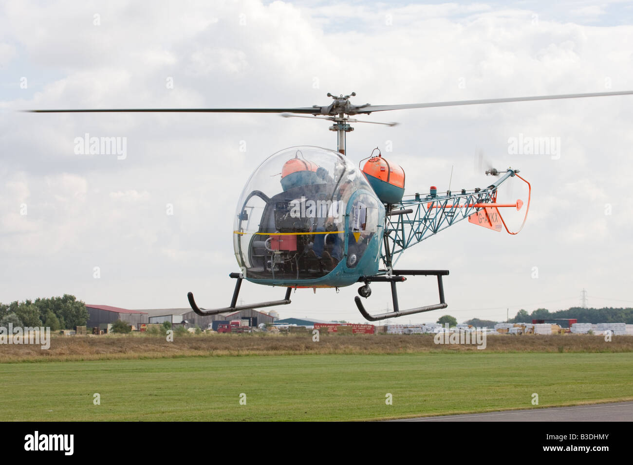 Westland Bell 47-G-4A G-AXKX taking-ff from Breighton Airfield Stock Photo