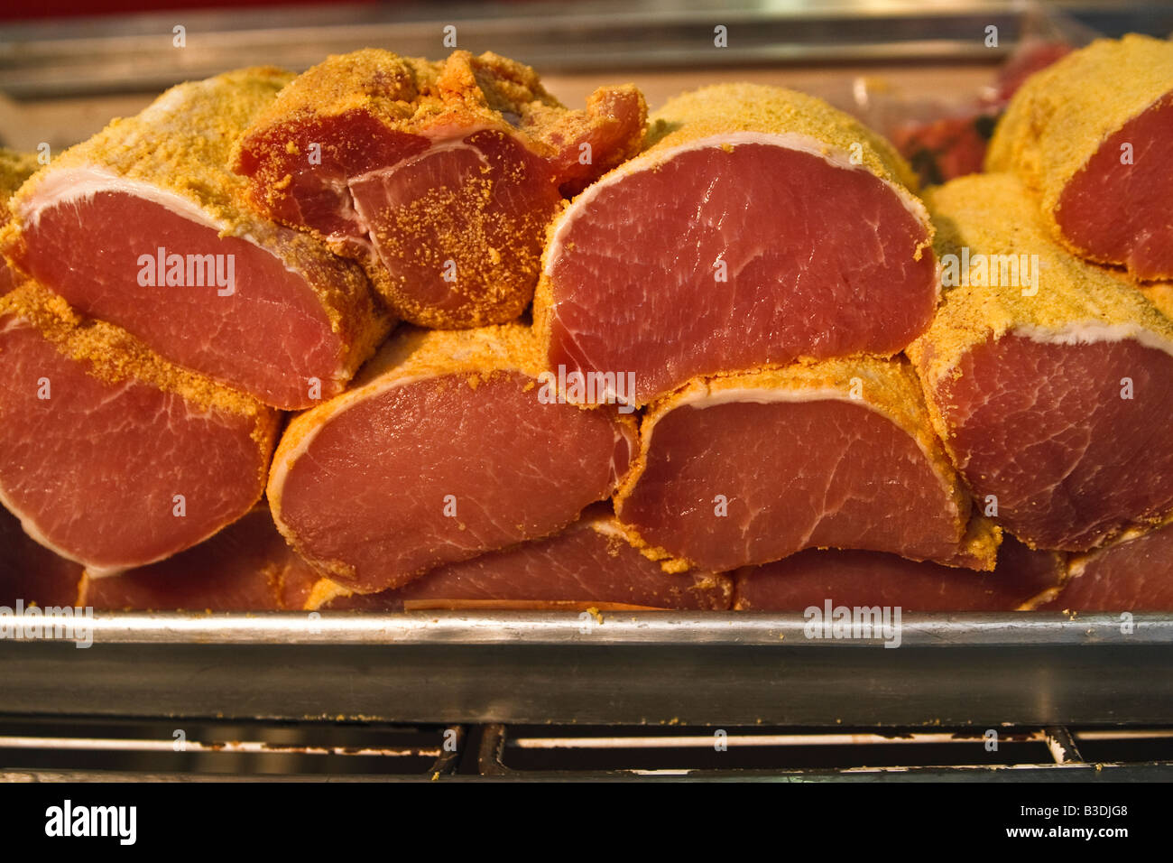 Peameal bacon close-up, pork in peameal corn breading on sale Stock Photo