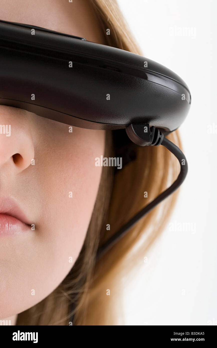 Girl wearing virtual reality headset Stock Photo - Alamy