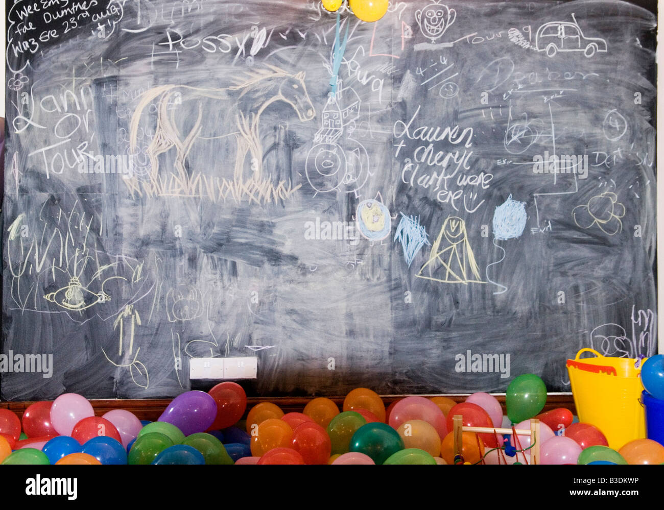 Chalk board and balloons Stock Photo - Alamy