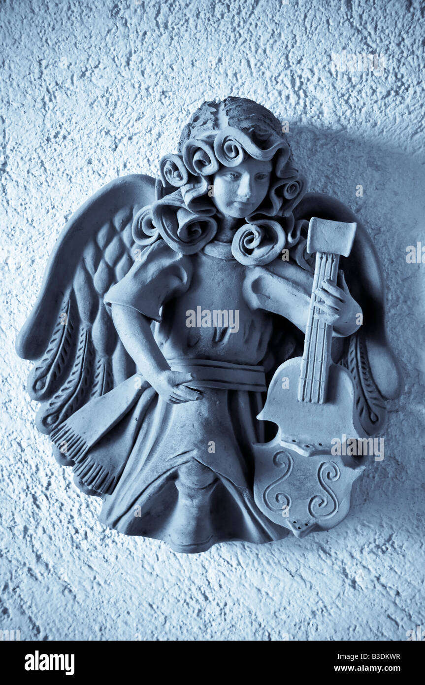 Pottery decorations of angelic musical figures at Zihuatanejo Mexico Stock Photo