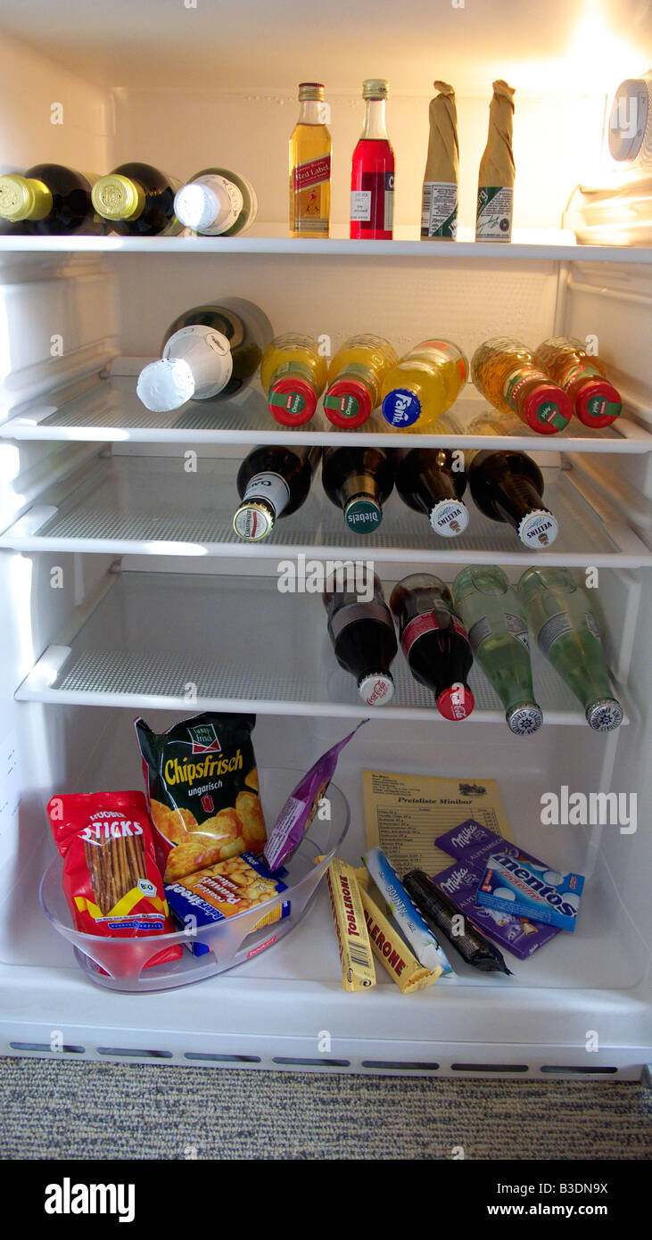 hotel business, mini-bar in the hotel room containing beverages, sweets and munchies Stock Photo