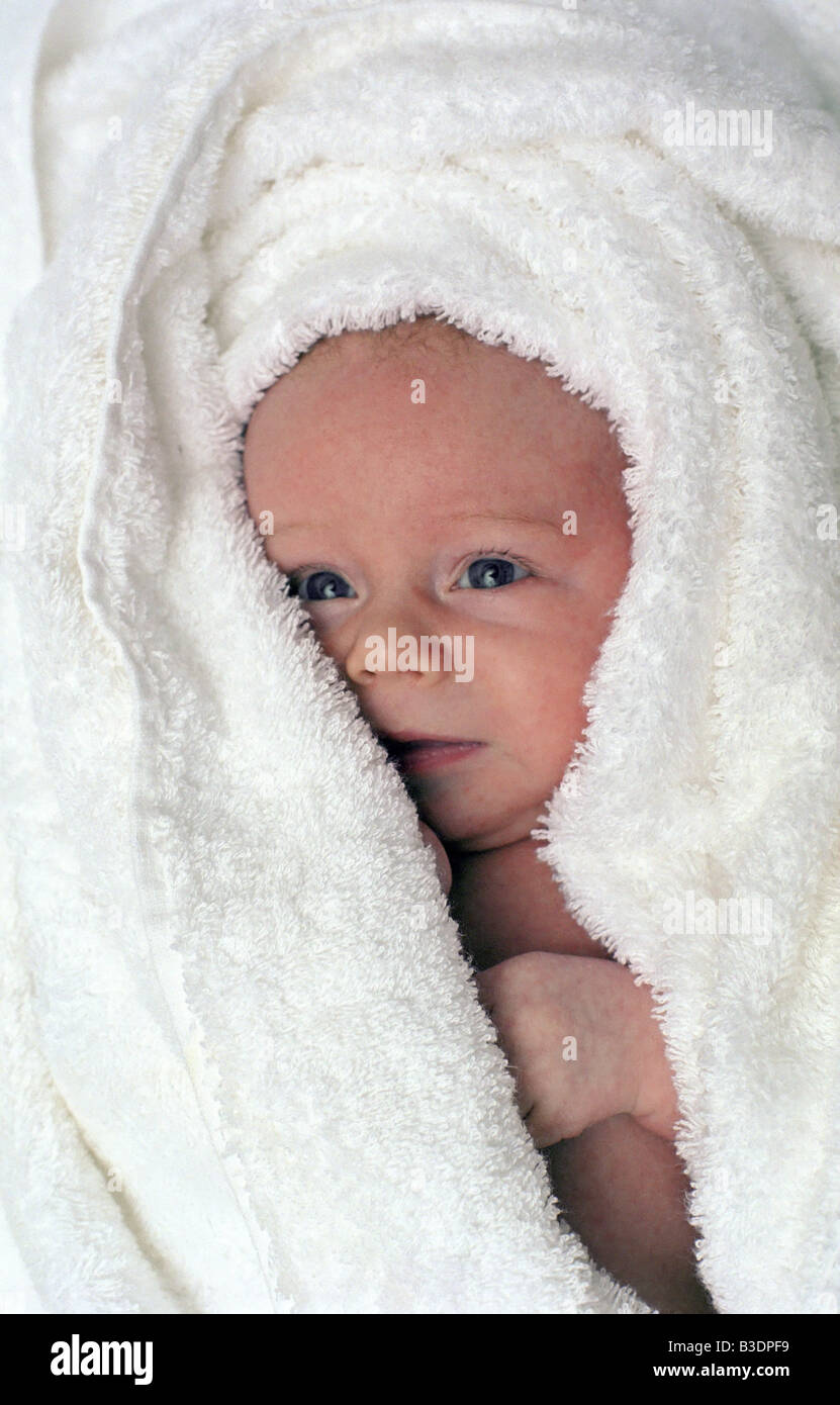 newborn child in white towel Stock Photo
