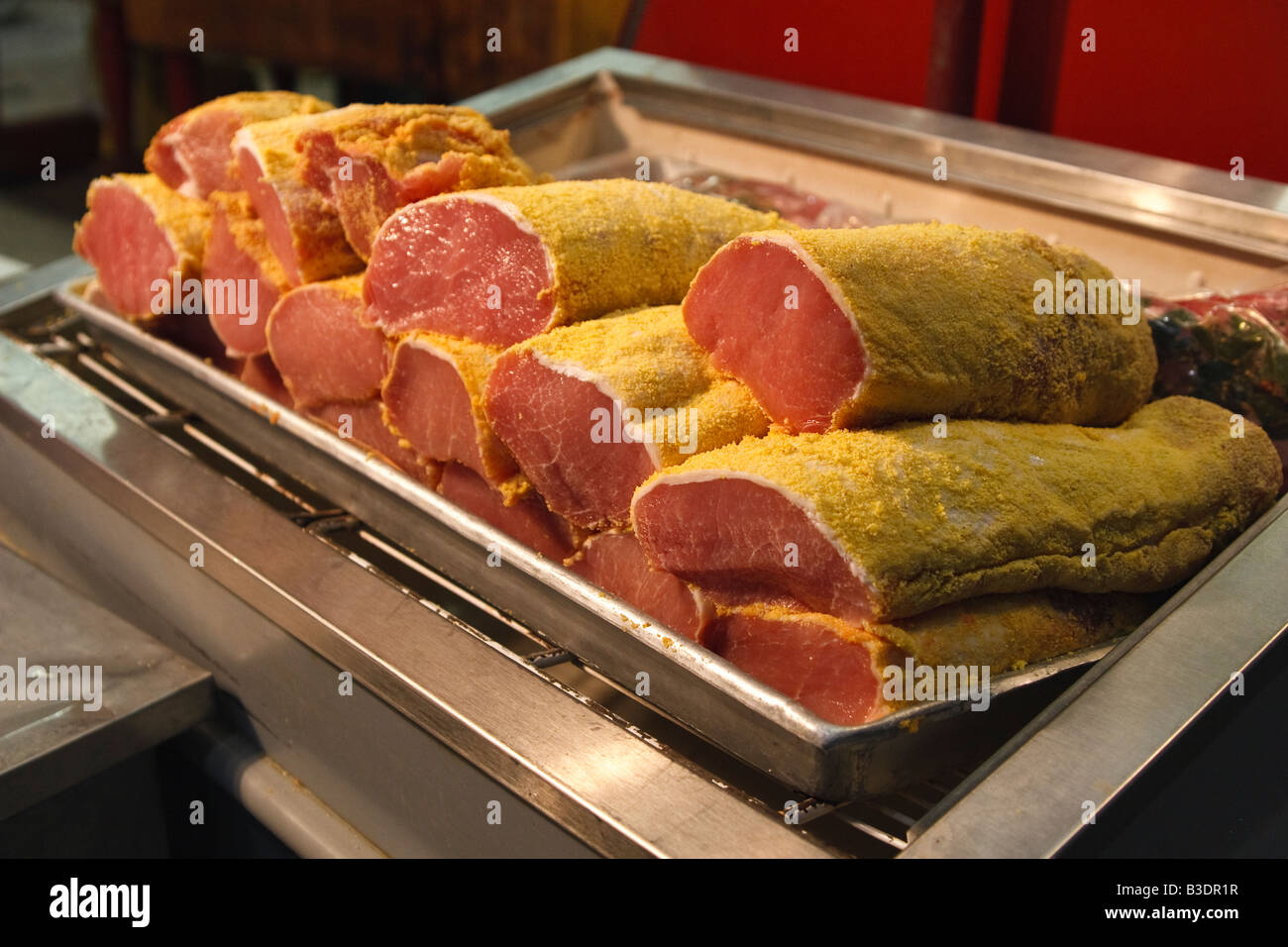 Peameal bacon closeup, pork in peameal corn breading on sale Stock
