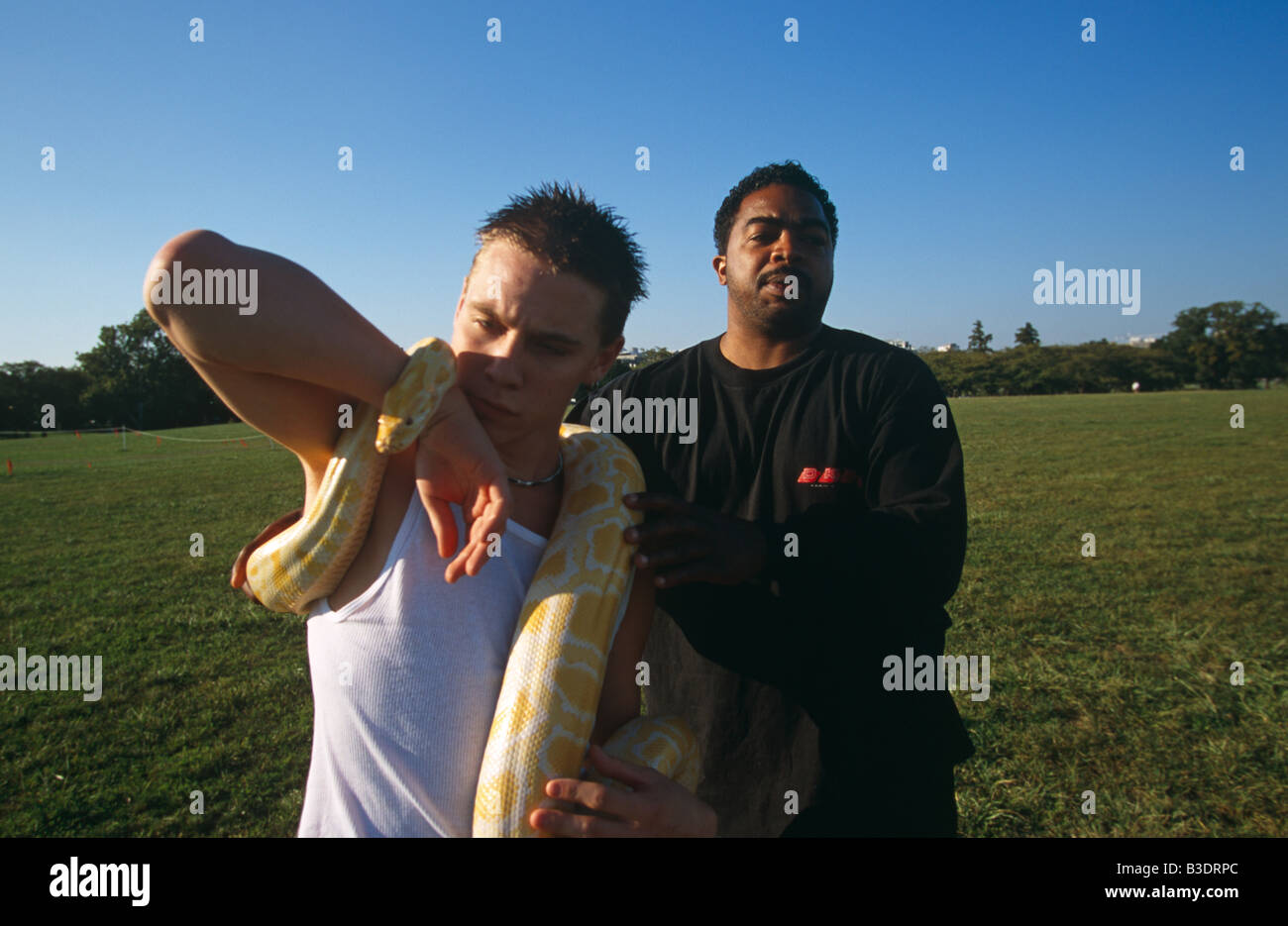 Young man posing with a python in Washington DC Stock Photo - Alamy