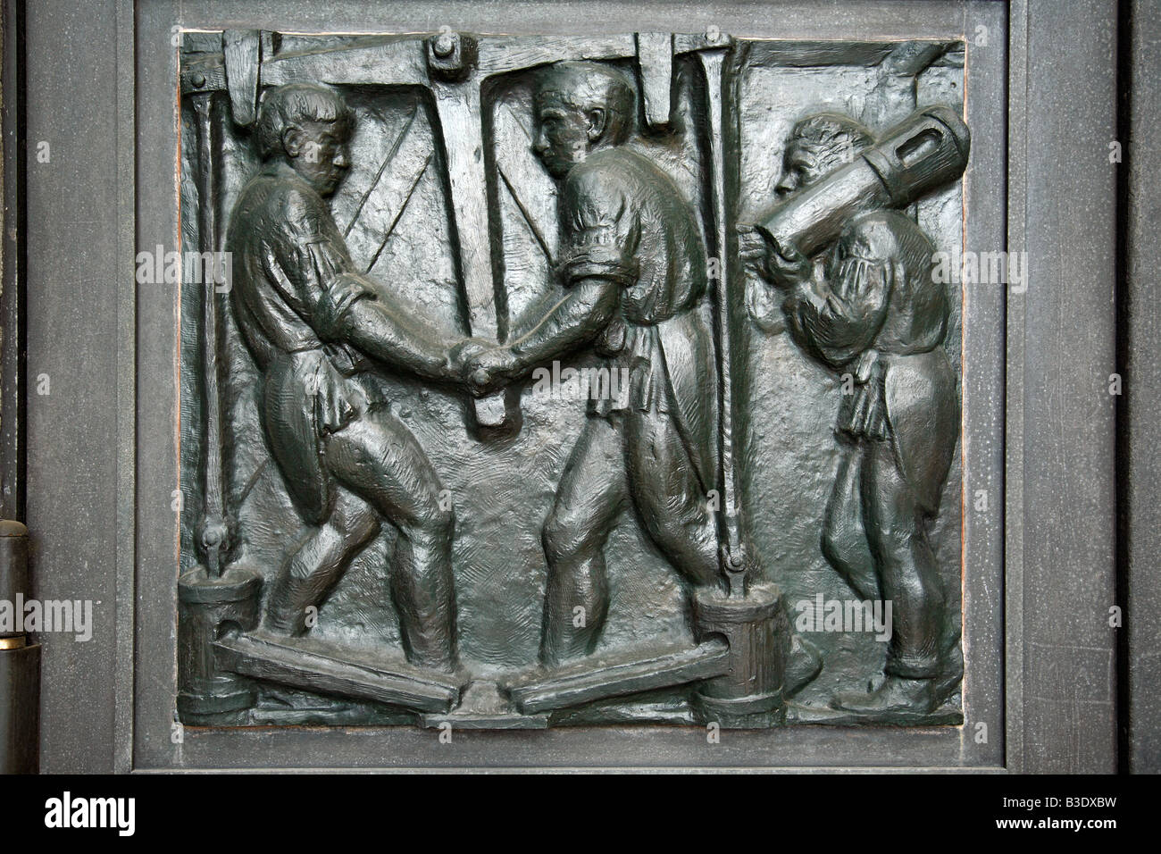 D-Bochum, Ruhr area, North Rhine-Westphalia, German Mining Museum, history and technology of mining and metallurgy, hard coal mining, main entrance, bronze gate, representation, relief, bronze relief, mineworkers, underground mining, Route of Industrial H Stock Photo