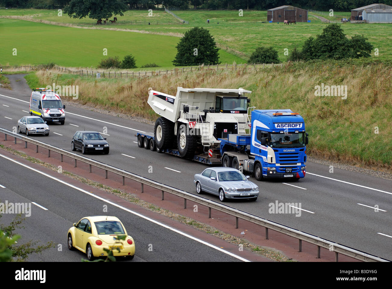 Large load on M40 motorway with escort vehicle behind England UK Stock Photo