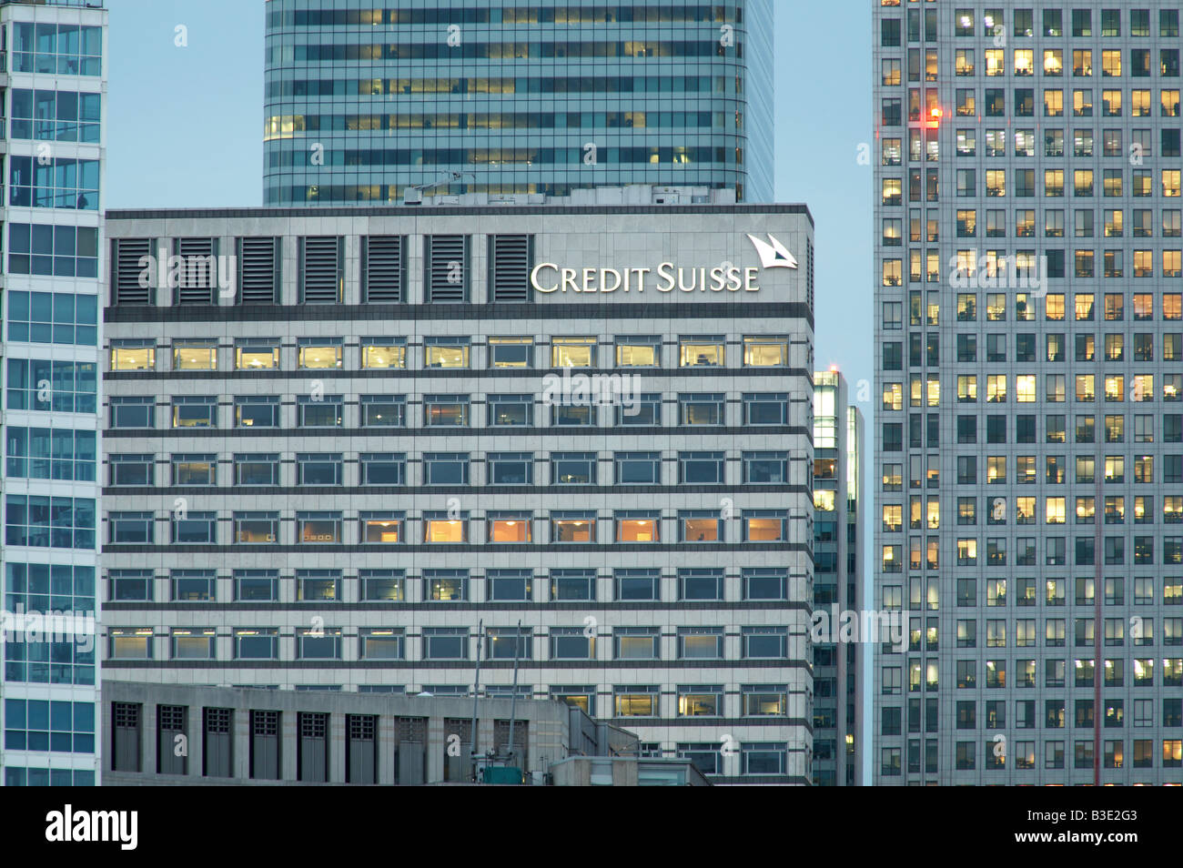 Credit Suisse bank HQ Headquarters offices Canary Wharf docklands skyline at dusk in London England UK Stock Photo