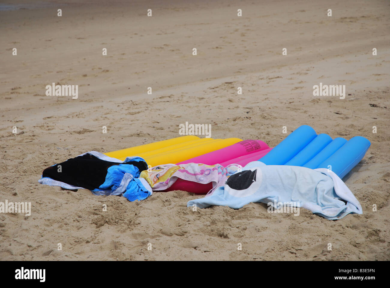 deserted airbeds and towels on Dutch beach Domburg Stock Photo