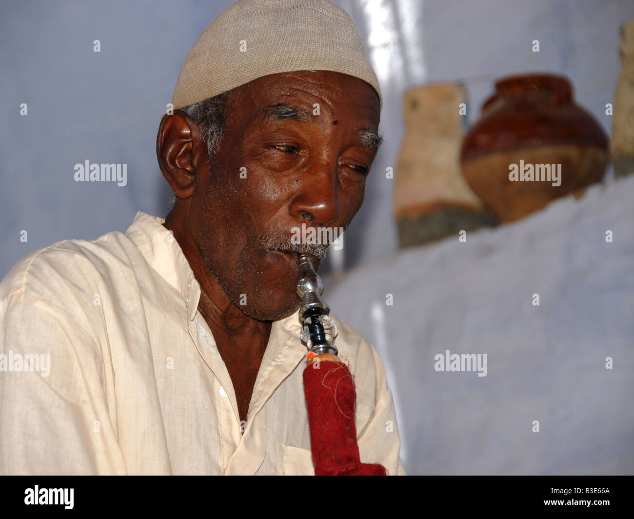 man relaxing with his water pipe Stock Photo - Alamy