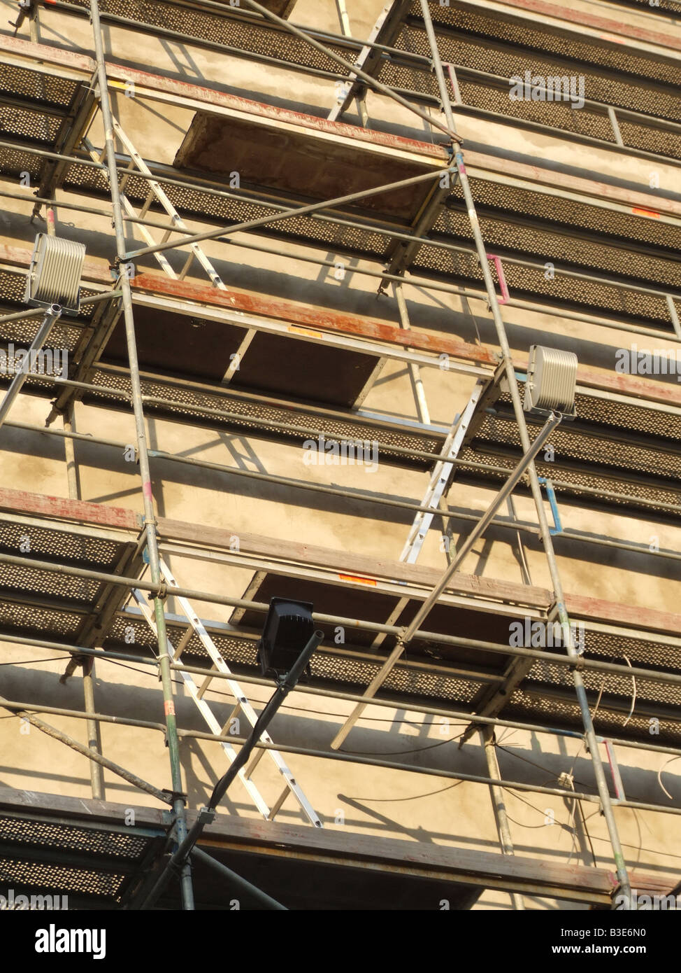 ladders and scaffolding on property building Stock Photo Alamy