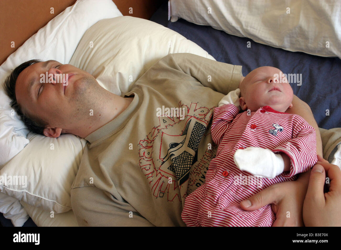 Newborn Baby Boy and father asleep Stock Photo Alamy